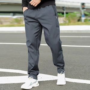 Detail of dark grey winter fleece-lined trousers with zipper pockets and elastic waist