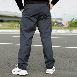 Close-up of men's thermal fleece sweatpants with elastic waistband and straight leg fit