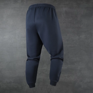 Rear view of dark blue fleece jogger pants featuring elastic waistband and ribbed cuffs