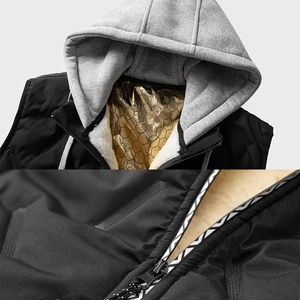Detail of warm hooded vest with lamb wool lining and golden thermal reflective coating