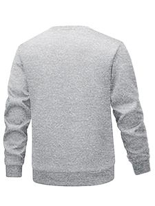 Detail of grey crewneck sweatshirt showing ribbed cuffs and hem with knit fabric texture