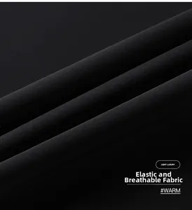 Close-up of black breathable ice silk fabric showing elastic texture and soft material