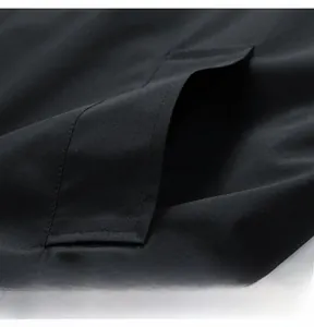 Macro detail of high-quality twill fabric and durable pocket stitching on black trousers