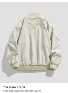Back view of cream oversized bomber jacket with ribbed collar and shoulder drop detail