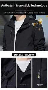 Detail of waterproof pockets and smooth zipper on a black hooded outdoor jacket