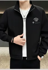 Close-up of men's black stand-collar jacket with shield logo and metallic zipper