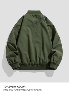 Back view of army green bomber jacket with ribbed cuffs and unique decorative back strap
