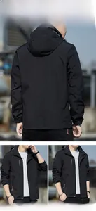 Detail showing elastic cuffs and windproof fabric of a men's black hooded jacket