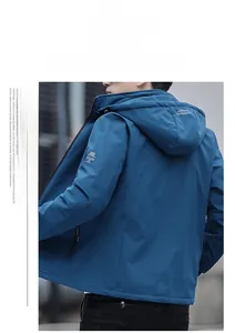 Detail of hooded jacket showing drawstring hood with mountain logo and letter print sleeves