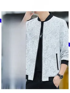 Detail of slim cut baseball collar jacket featuring grey palm leaf print and ribbed cuffs