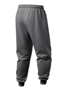Detail of dark grey fleece joggers showing elastic waistband and ribbed cuffs texture