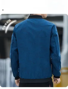 Rear view of a slim fit navy blue bomber jacket with subtle leaf pattern and ribbed cuffs