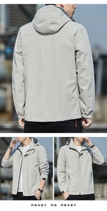 Detail view of adjustable hood and windproof fabric on men's light grey casual jacket