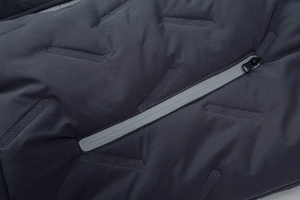 Close-up of matte charcoal gray men hoodie jacket with quilted pattern and zipper detail