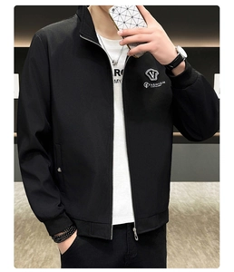 Detail of premium black stand collar jacket featuring silver fashion logo on chest