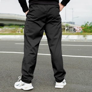 Rear view of men's fleece lined black winter sweatpants with elastic waist for warmth