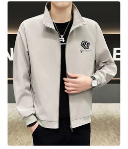 Detail of light grey stand collar jacket featuring F-Fashion patch and metal zipper