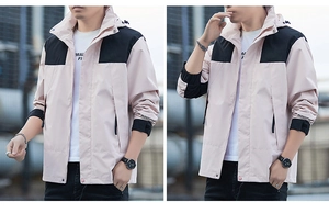 Detail of pink and black outdoor jacket showing adjustable velcro cuffs and hood