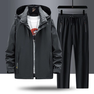 Waterproof dark grey outdoor hiking jacket and pants set with functional zipper pockets