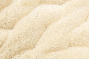 Detail shot of the plush lamb wool lining showing soft texture and high-density fibers