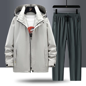 Men's outdoor hiking suit with light gray hooded jacket and charcoal trousers set