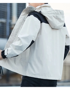 Detail of color-block outdoor jacket with hooded design and FASHION sleeve print
