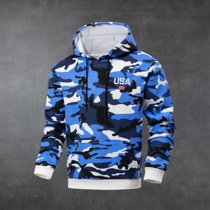 Detail of USA embroidery and flag on camo hoodie with contrast white ribbed cuffs