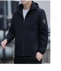 Close-up detail of windproof jacket sleeve with ROD badge and elastic ribbed cuffs