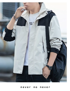 Outdoor waterproof jacket for men featuring black shoulder patchwork and adjustable cuffs