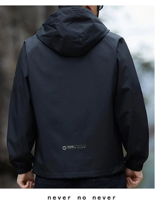 Detail of windproof jacket back showing MENN CLAW logo and raglan sleeve design