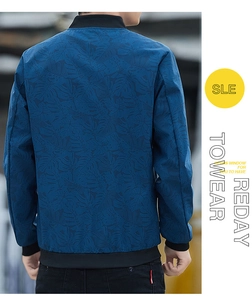 Detail of navy blue camouflage bomber jacket featuring ribbed collar and cuffs on model back