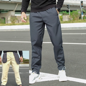 Men's thermal winter pants in dark grey with warm yellow fleece lining for outdoors
