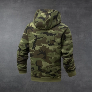 Rear view of camouflage hoodie with rib-knit cuffs and hem on gray industrial background