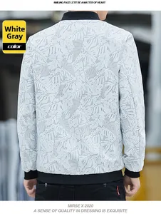 Close-up of white gray camouflage jacket with ribbed collar and tropical leaf pattern