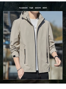 Detailed close-up of khaki windbreaker showing adjustable drawstring hood and zipper pocket