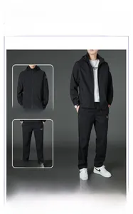 Detail of black hooded jacket and matching trousers set for men in breathable sport fabric