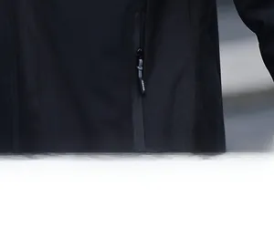 Detail of windbreaker jacket pocket with fashion zipper pull and premium woven fabric