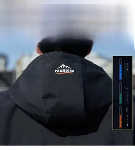 Detail of windproof black hooded jacket featuring FASHIONS logo and mountain graphic