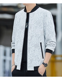 Close-up of men's spring jacket featuring white palm leaf print and black ribbed collar