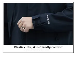 Detail of adjustable velcro strap and elastic cuffs on a black waterproof outdoor jacket