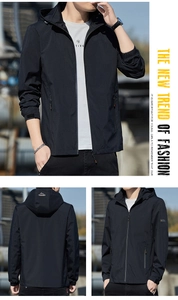 Detail of adjustable velcro cuffs and windproof fabric on a black men's hooded jacket