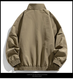 Back view of a khaki outdoor jacket showing the stand collar and elastic cuffs