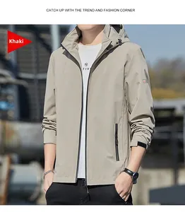 Detail of khaki windproof jacket with adjustable velcro cuffs and functional zipper pockets