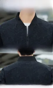 Detail view of black camo bomber jacket showing metal zipper and ribbed stand collar