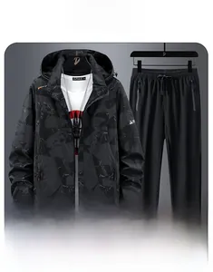 Close-up of waterproof zipper and geometric camo texture on hooded outdoor sports jacket