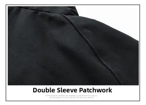 Detailed view of raglan sleeve stitching on a black men's contrast standing collar jacket