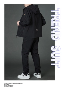 Detail of black hooded sports suit featuring lightweight windproof jacket and joggers