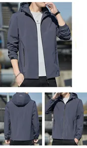 Detail view of men's slim fit hooded windbreaker jacket with zipper pockets and elastic cuffs