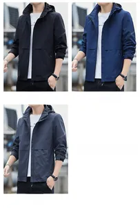Mens hooded windbreaker jacket detail in black, deep blue and dark grey with velcro cuffs