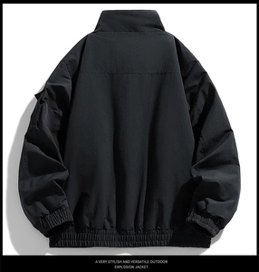 Rear view detail of black outdoor jacket with elastic windproof hem and ribbed cuffs